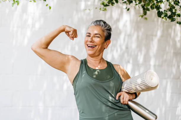 Active woman with a yoga mat