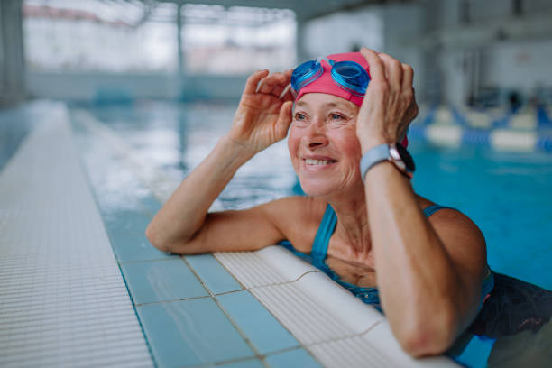 Woman swimming at an indoor pool